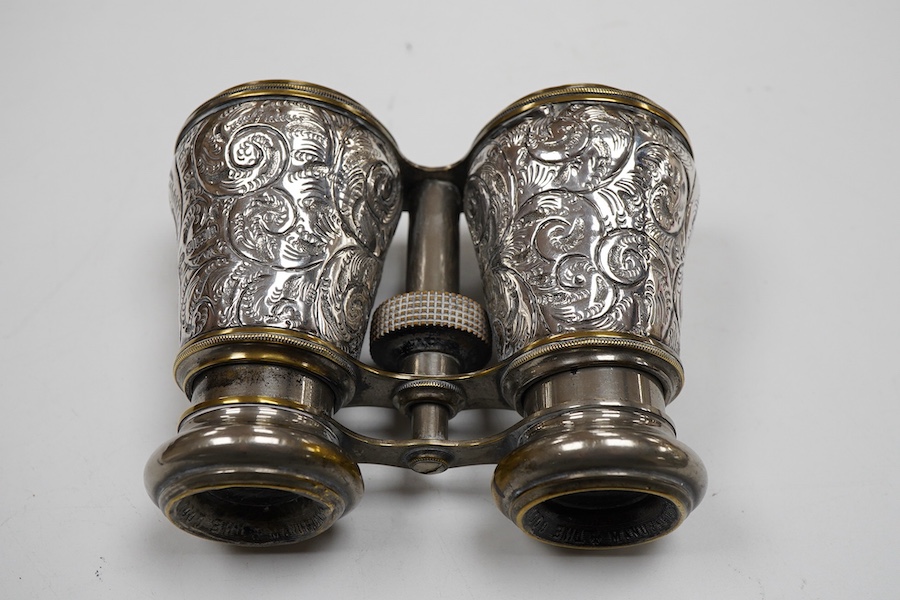 A pair of late Victorian repousse silver mounted plated brass opera glasses, Henry Charles Kelly, Birmingham, 1900, 8.8cm by 11.6cm.